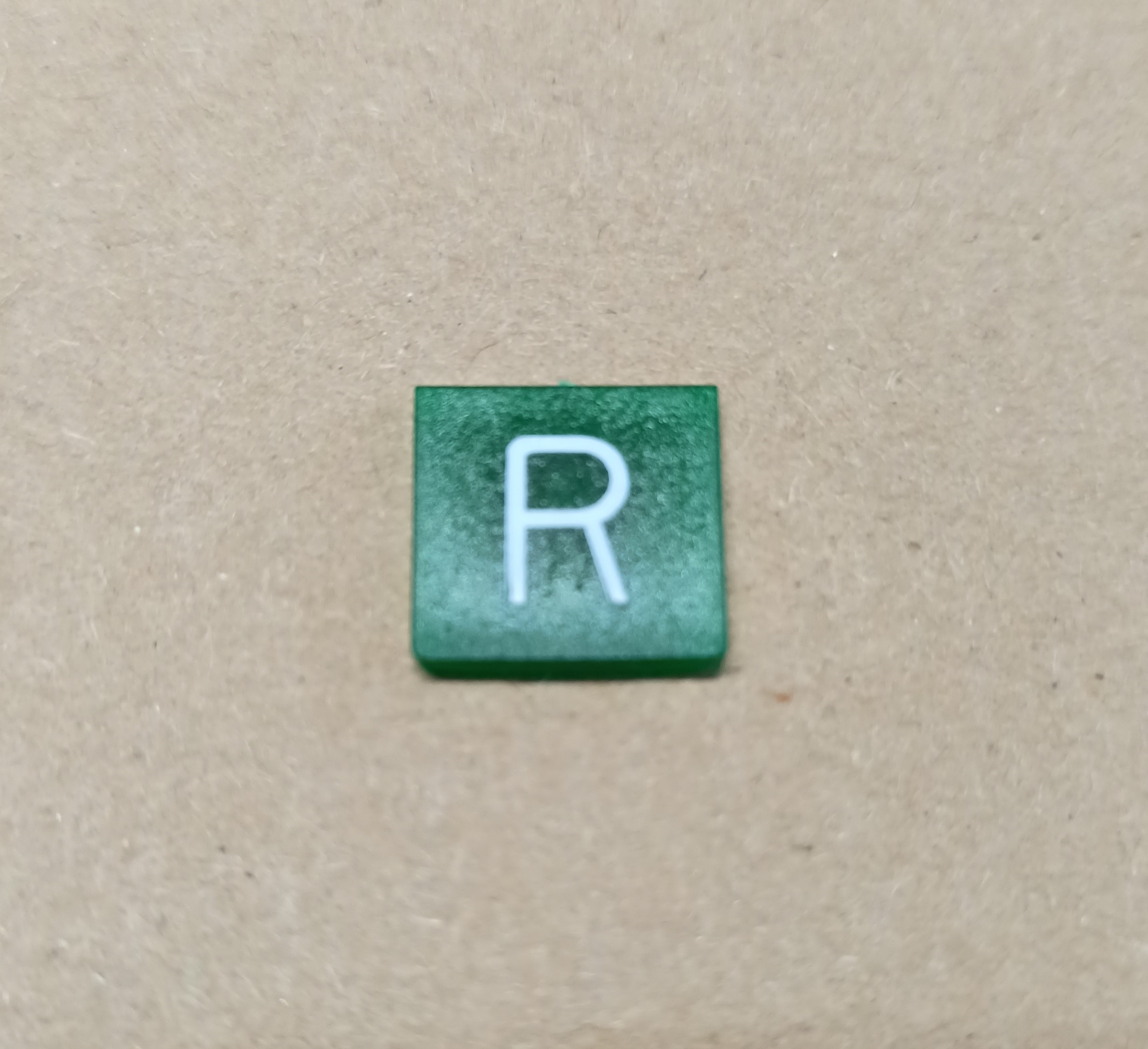 Symbol překlápěcího přepínače - 14x14mm - zelený - zpátečka "R"
