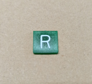 Symbol překlápěcího přepínače - 14x14mm - zelený - zpátečka "R"