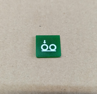 Symbol překlápěcího přepínače - 14x14mm - zelený - náprava s šipkou