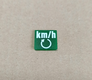 Symbol překlápěcího přepínače - 14x14mm - zelený -  km/h + kruhová šipka